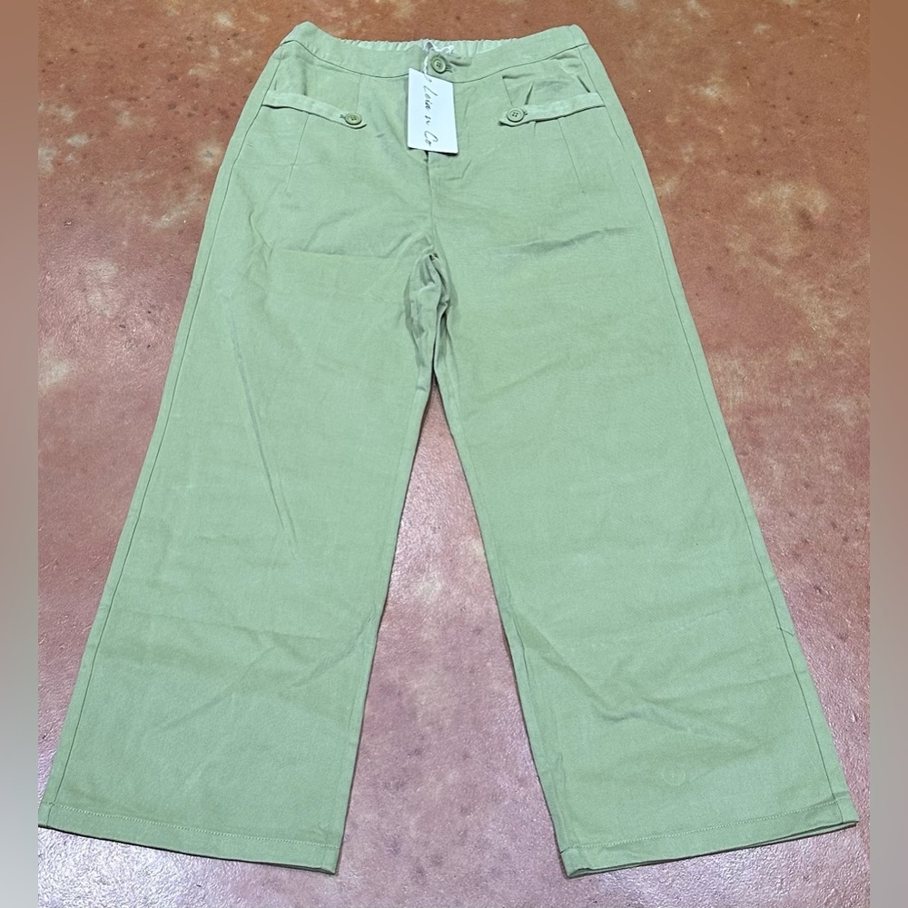Nwt Boutique Sage Green Wide Leg Pant with pockets and elastic back for comfort.